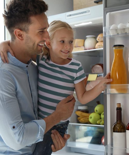 Father,And,Daughter,Taking,Bottle,With,Juice,Out,Of,Refrigerator